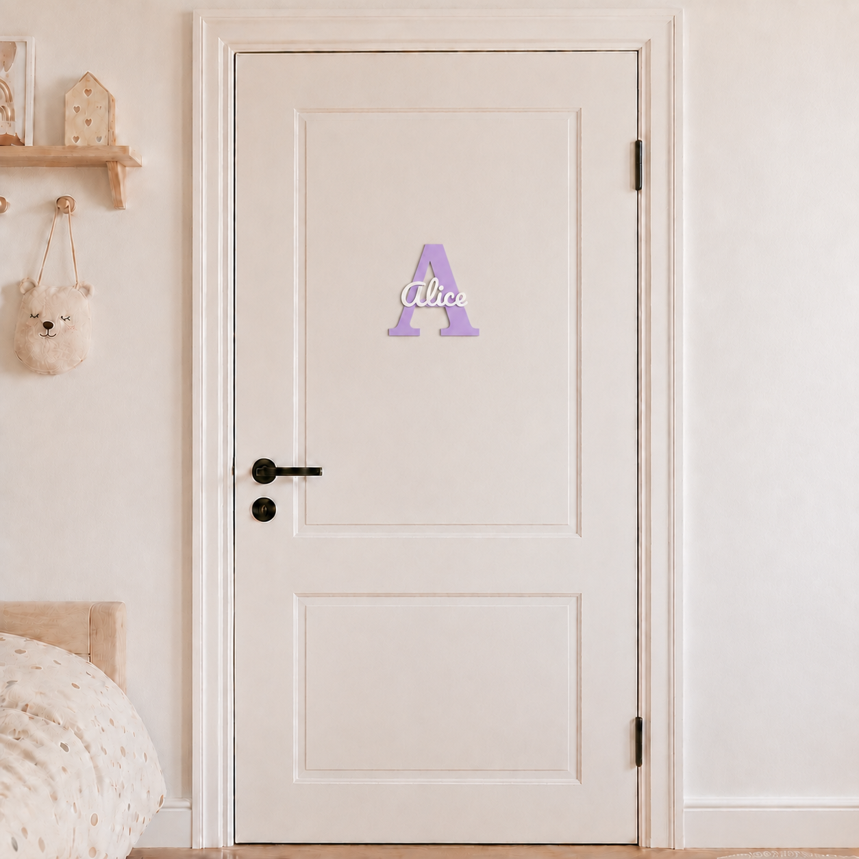 Purple 3D printed letter A name sign with the name Alice in white script, mounted on a child's bedroom door
