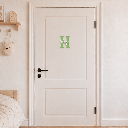 Green 3D printed letter H name sign with the name Hugo in white script, mounted on a child's bedroom door