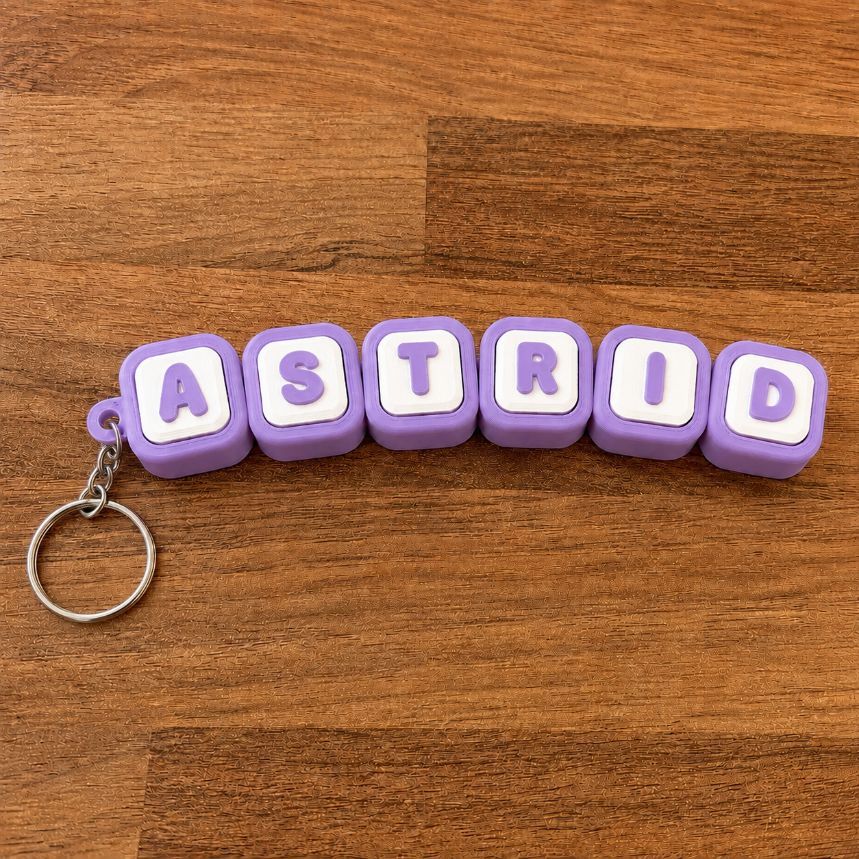 Personalized name tag clicker keyring 'Astrid' — purple steel keyring, 3D printed