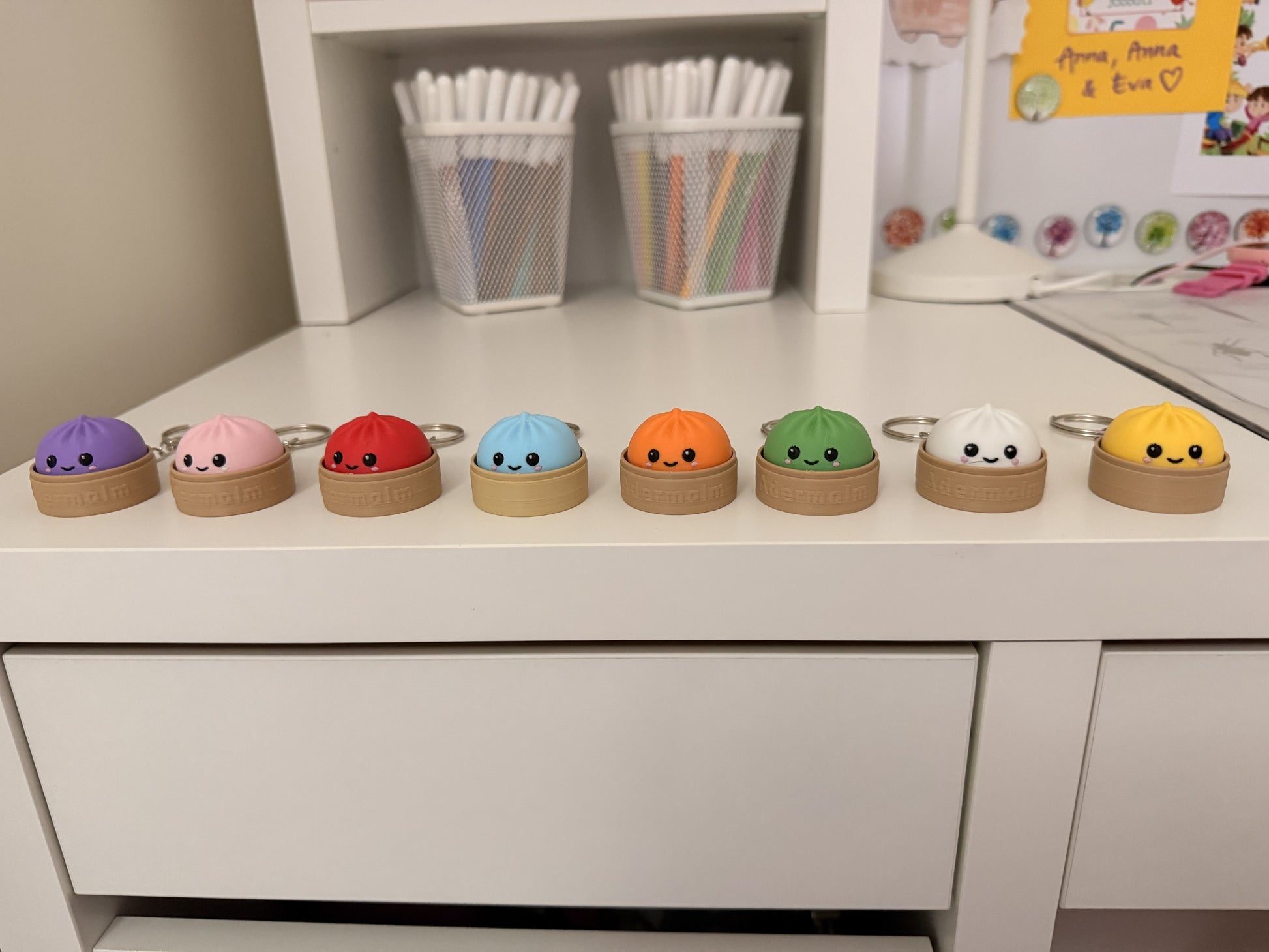 All eight dumpling clicker keychain colors in daylight