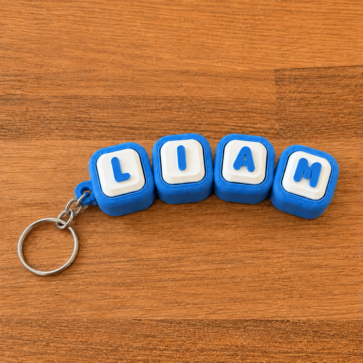 Personalized name tag clicker keyring 'Liam' — blue steel keyring, 3D printed