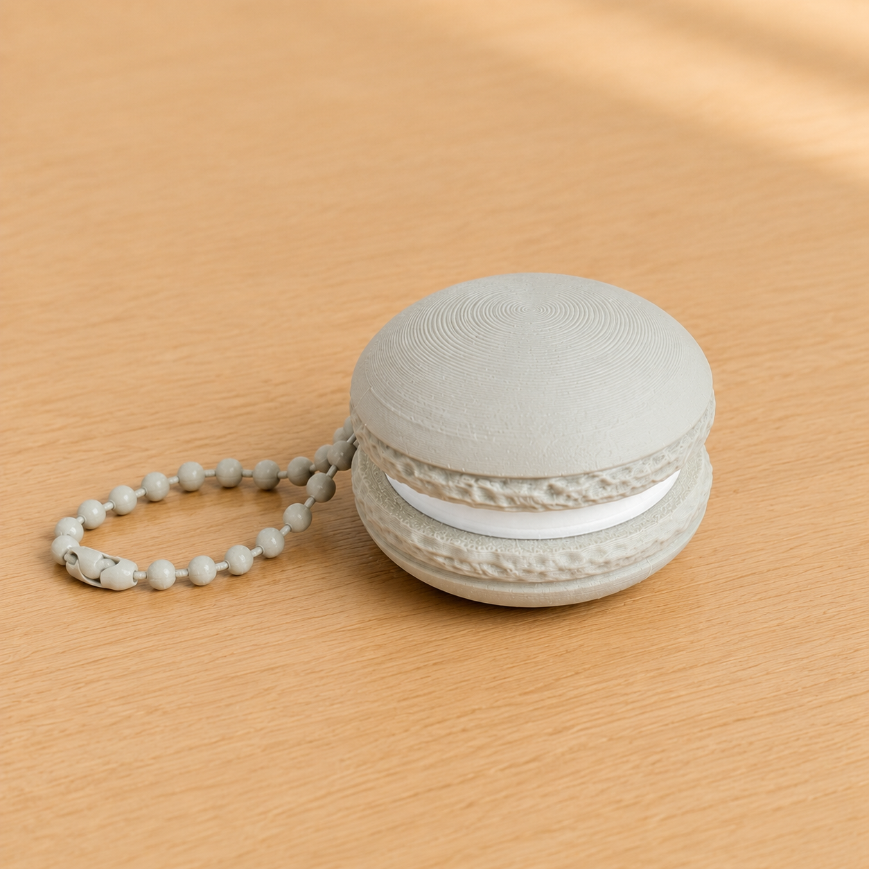 Bone White 3D printed macaron fidget clicker keychain with white filling and matching ball chain