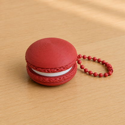 Dark Red 3D printed macaron fidget clicker keychain with white filling and matching ball chain