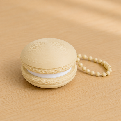 Desert Tan 3D printed macaron fidget clicker keychain with white filling and matching ball chain