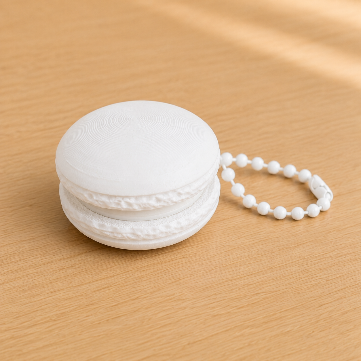 Ivory White 3D printed macaron fidget clicker keychain with white filling and matching ball chain