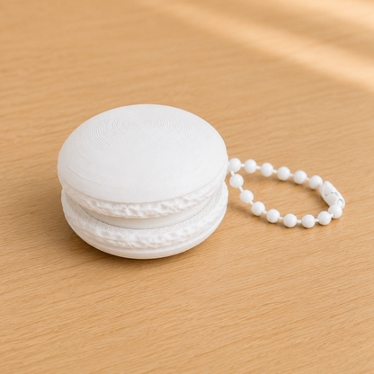 Ivory White 3D printed macaron fidget clicker keychain with white filling and matching ball chain