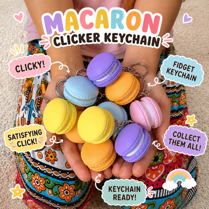 Macaron fidget clicker keychains in pastel colours held in a child's hands