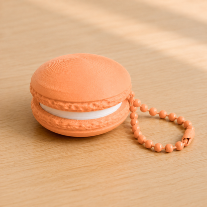 Mandarin Orange 3D printed macaron fidget clicker keychain with white filling and matching ball chain