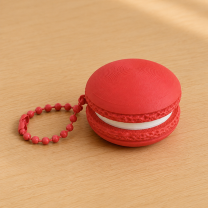 Scarlet Red 3D printed macaron fidget clicker keychain with white filling and matching ball chain
