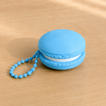 Sky Blue 3D printed macaron fidget clicker keychain with white filling and matching ball chain
