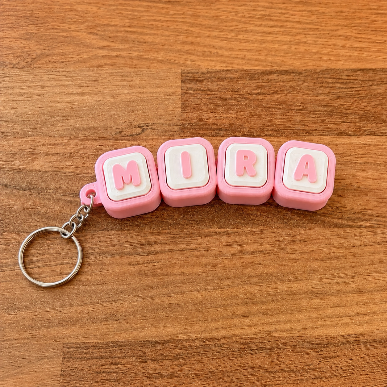 Personalized name tag clicker keyring 'Mira' — pink steel keyring, 3D printed