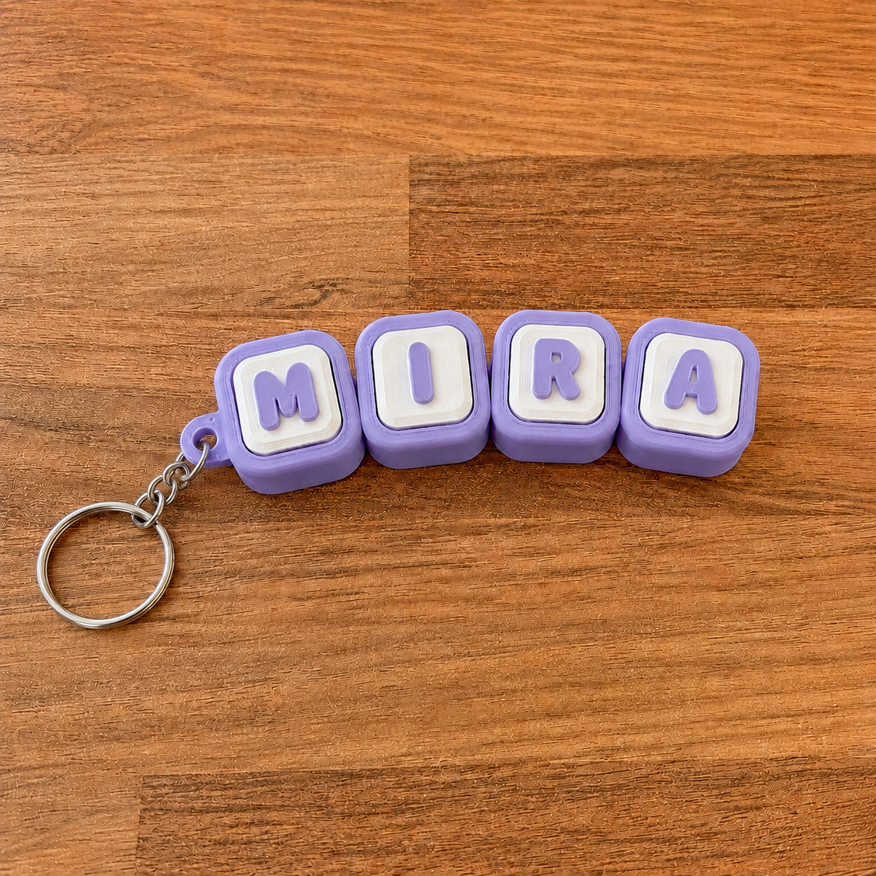 Personalized name tag clicker keyring 'Mira' — purple steel keyring, 3D printed