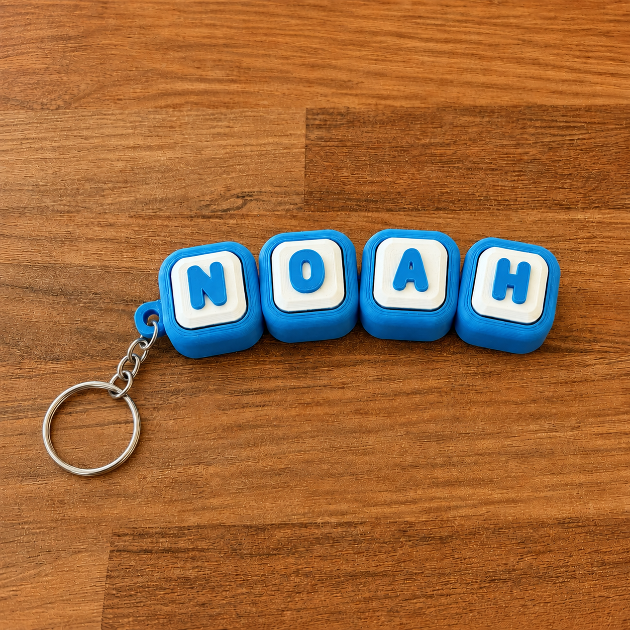 Personalized name tag clicker keyring 'Noah' — blue steel keyring, 3D printed