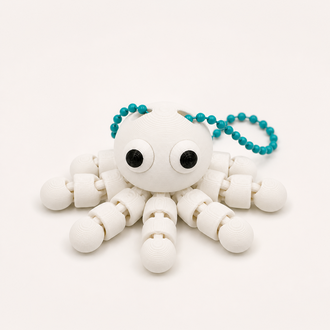 Ivory White articulated octopus flexi keychain with white eyes, on a ball chain