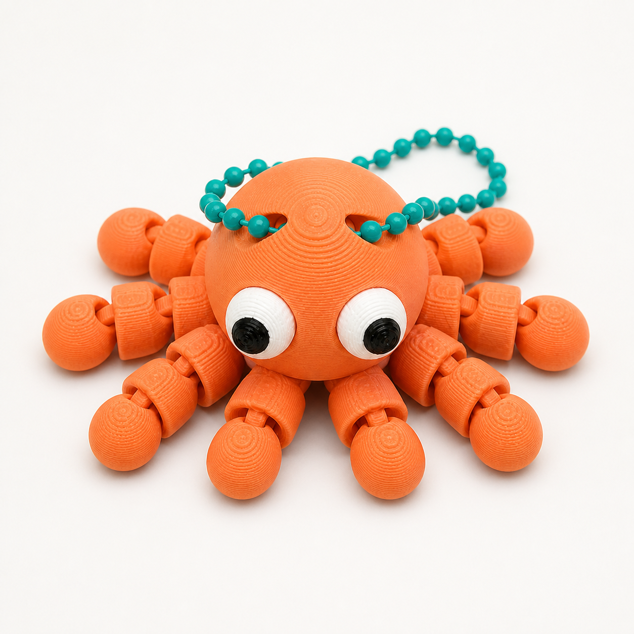 Mandarin Orange articulated octopus flexi keychain with white eyes, on a ball chain