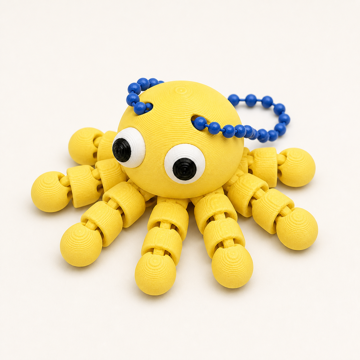 Lemon Yellow articulated octopus flexi keychain with white eyes, on a ball chain