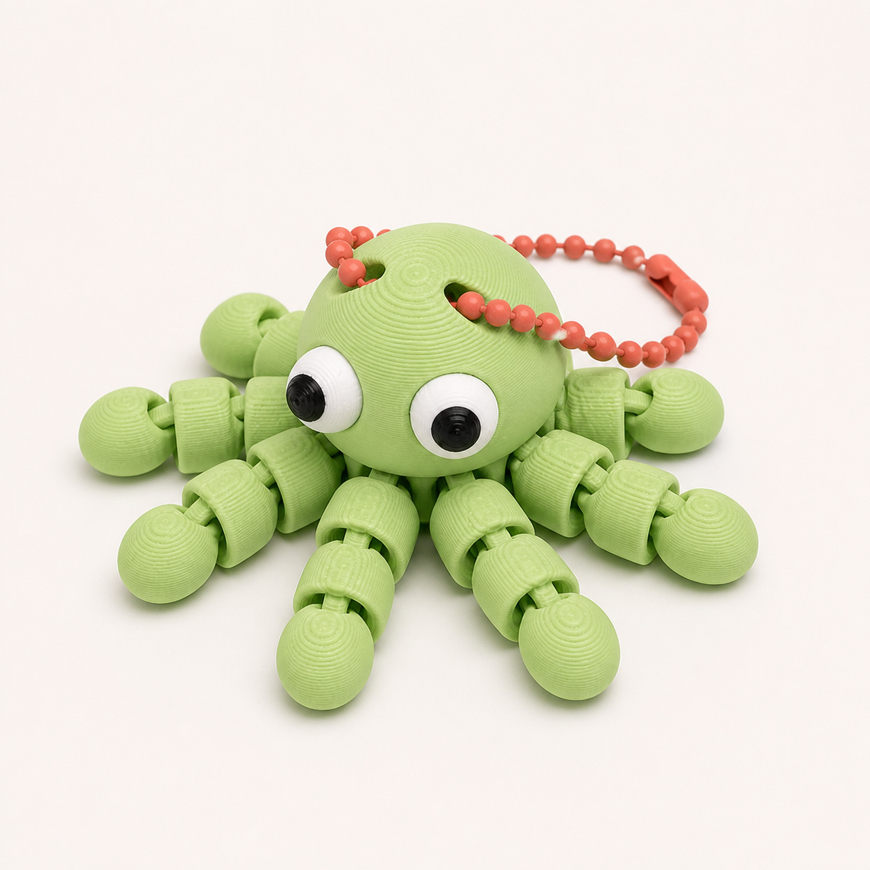 Apple Green articulated octopus flexi keychain with white eyes, on a ball chain
