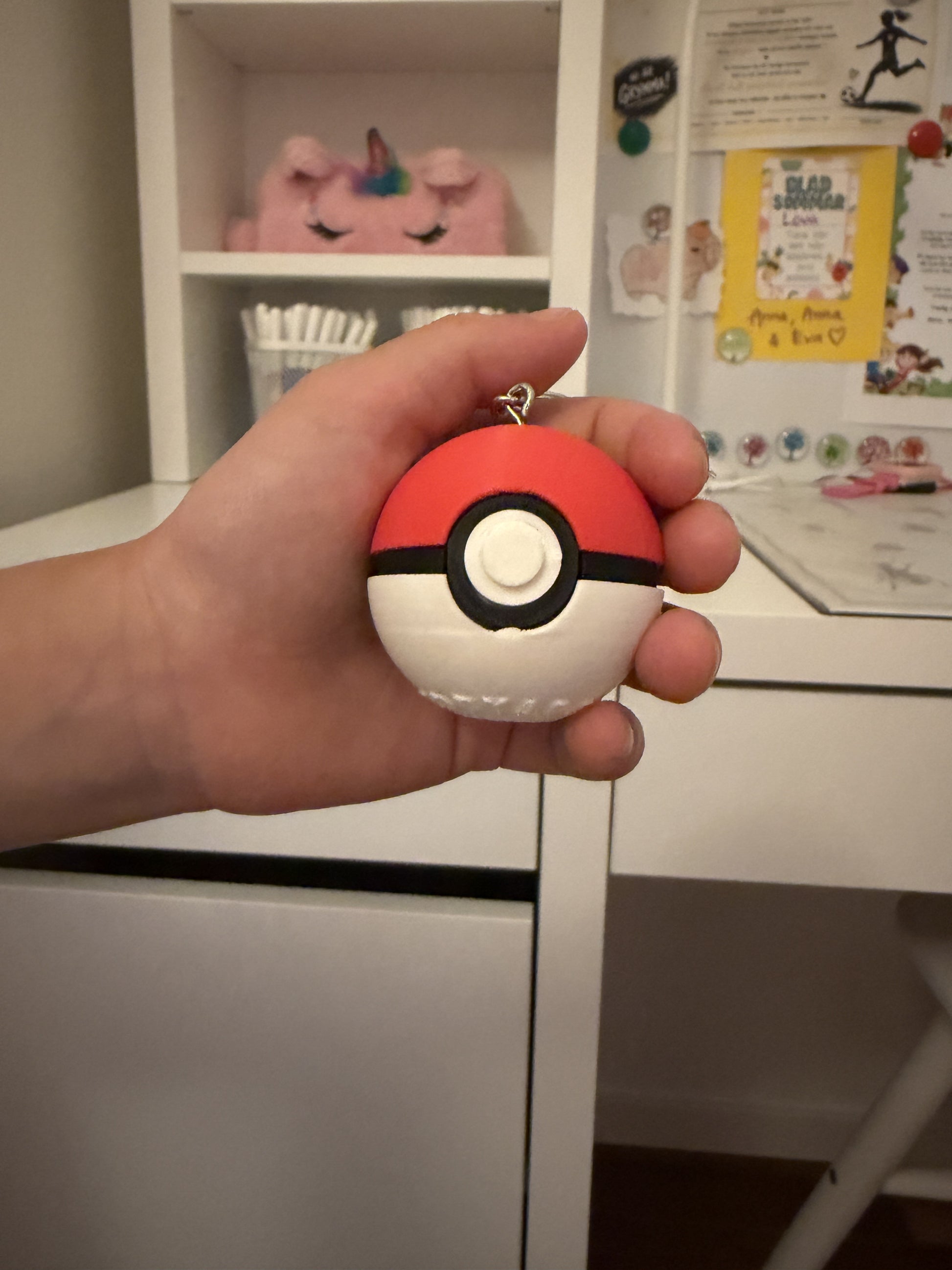 Classic red and white Poké Ball clicker keychain