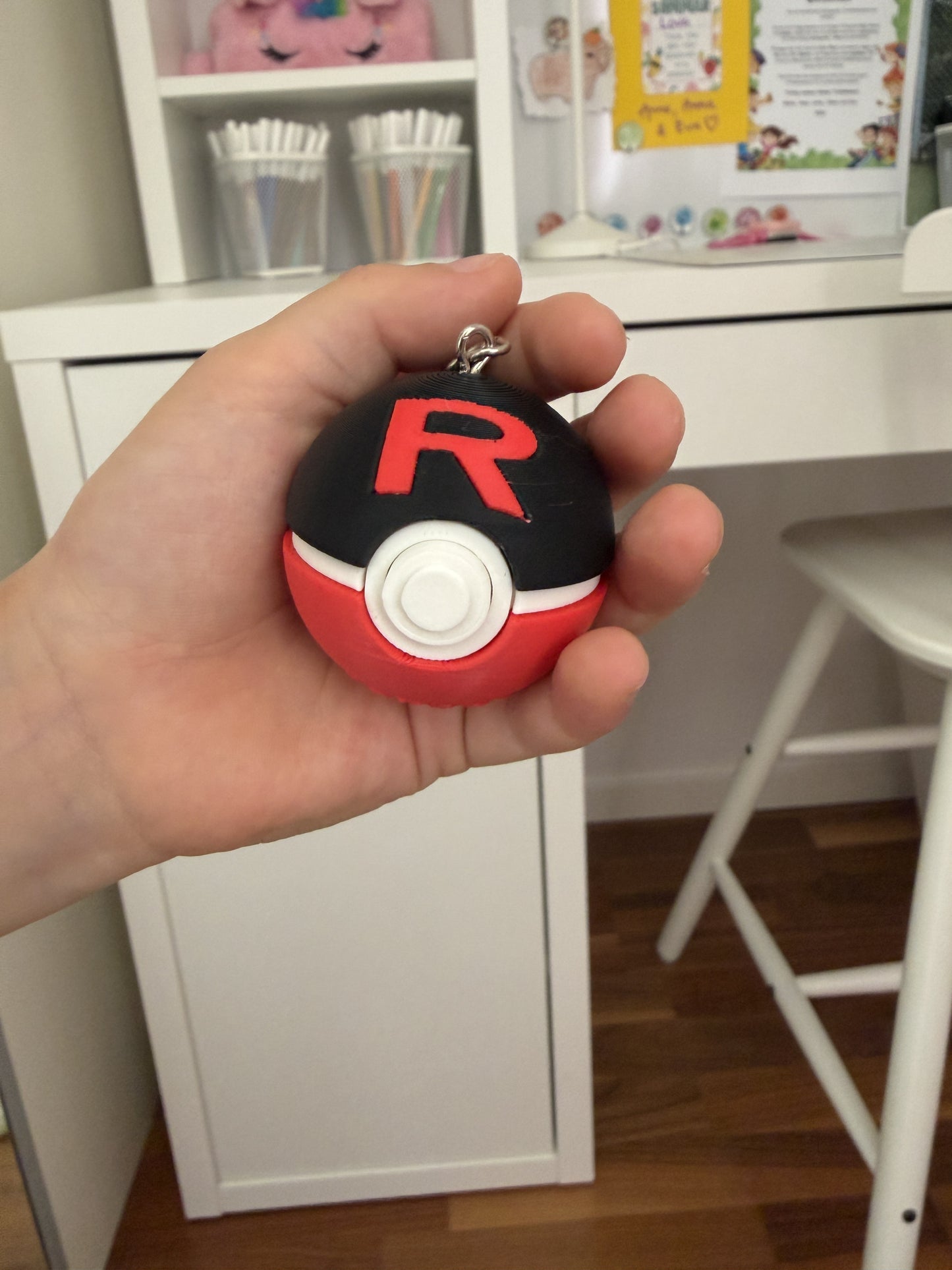 Black and red Team Rocket Ball clicker keychain